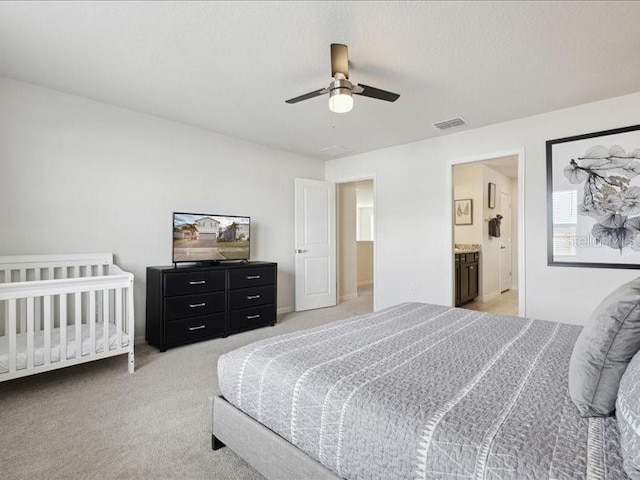 bedroom featuring light carpet and ceiling fan