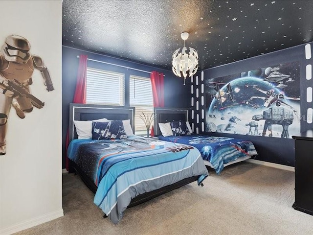 bedroom with carpet flooring, a textured ceiling, and an inviting chandelier