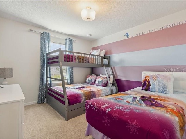 carpeted bedroom featuring a textured ceiling