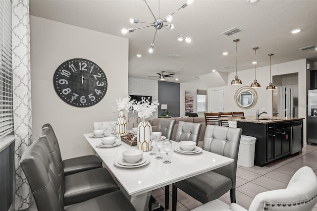 1607 Kona Ln, Davenport, FL 33897 - dining room featuring light tile patterned flooring, a ceiling fan, recessed lighting, and a chandelier