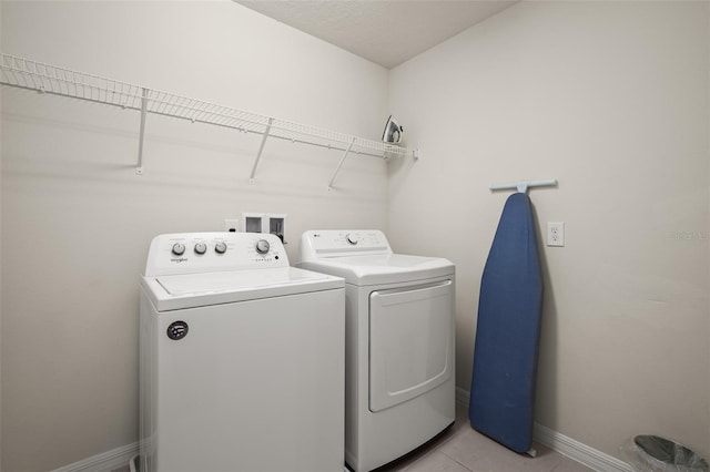 1607 Kona Ln, Davenport, FL 33897 - laundry room with washer and dryer and light tile patterned floors