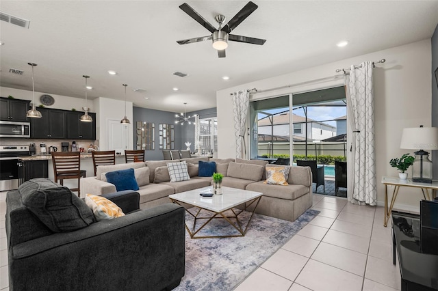 1607 Kona Ln, Davenport, FL 33897 - living area featuring ceiling fan, light tile patterned flooring, recessed lighting, and a chandelier
