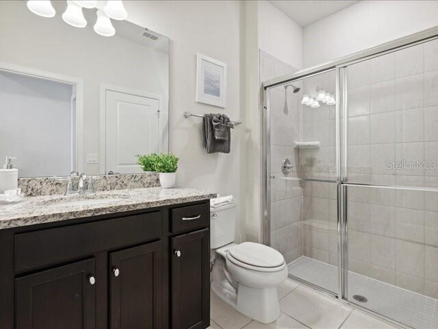 1607 Kona Ln, Davenport, FL 33897 - bathroom with vanity, a stall shower, and tile patterned flooring