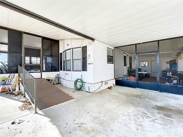 view of home's exterior featuring a carport