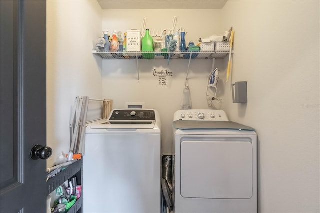 laundry room with independent washer and dryer