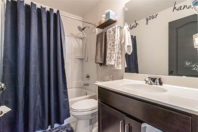 full bathroom featuring shower / tub combo with curtain, vanity, and toilet