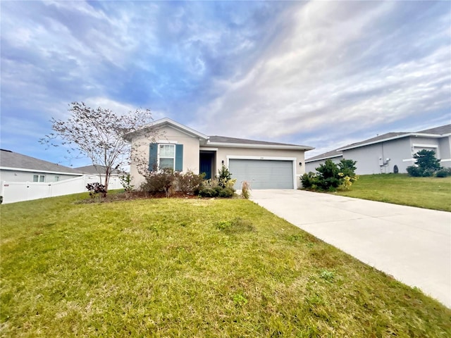 ranch-style house with a garage and a front lawn