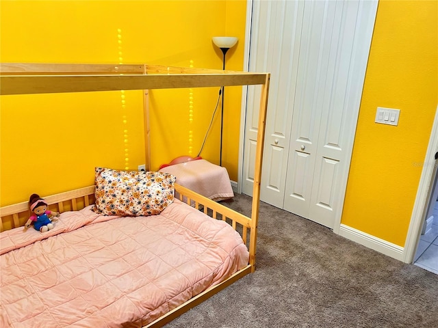 carpeted bedroom with a closet