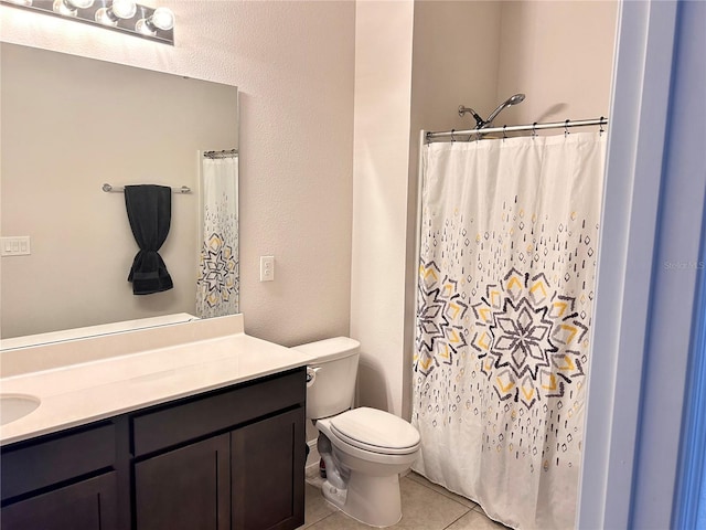 bathroom with tile patterned flooring, vanity, toilet, and a shower with curtain