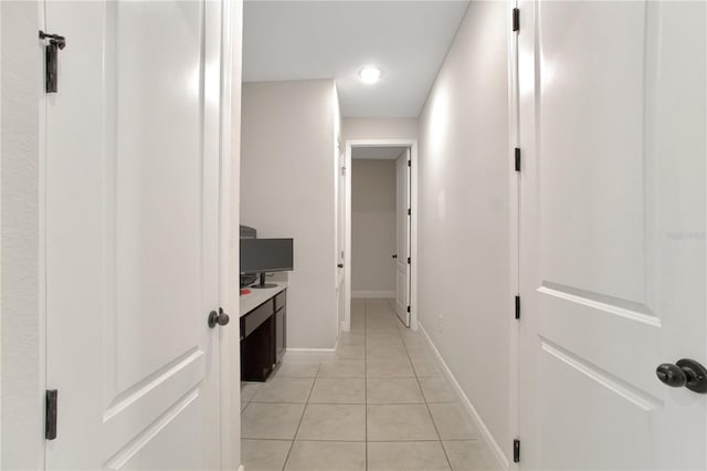 corridor with light tile patterned flooring