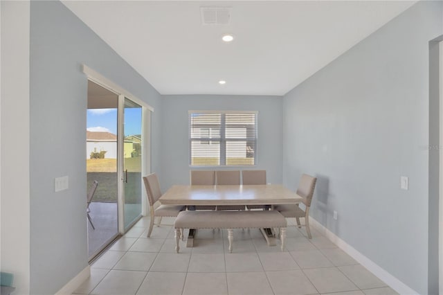 unfurnished dining area featuring light tile patterned flooring