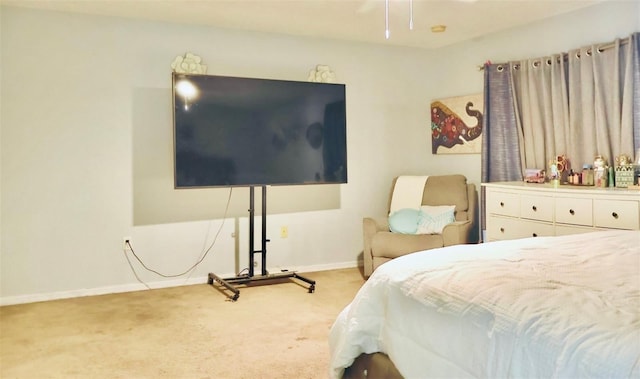 bedroom with baseboards and carpet floors