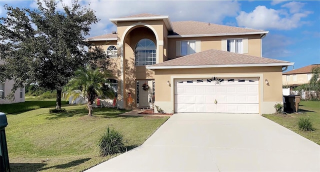 traditional-style house with stucco siding, an attached garage, and a front lawn