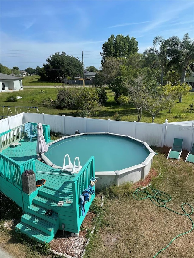 view of pool featuring a fenced in pool and a fenced backyard