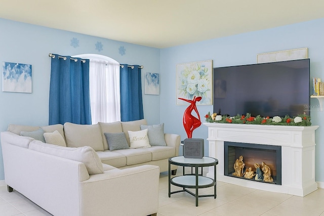 living room featuring a fireplace and light tile patterned floors