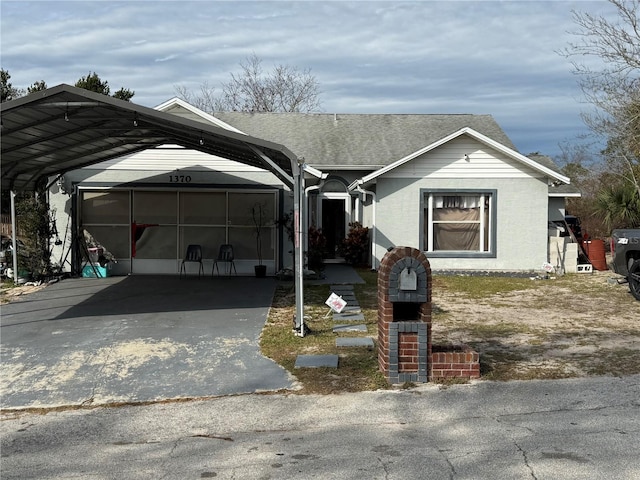 view of front of home with a carport