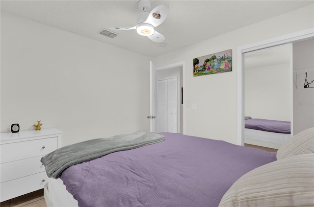 bedroom featuring ceiling fan and a closet