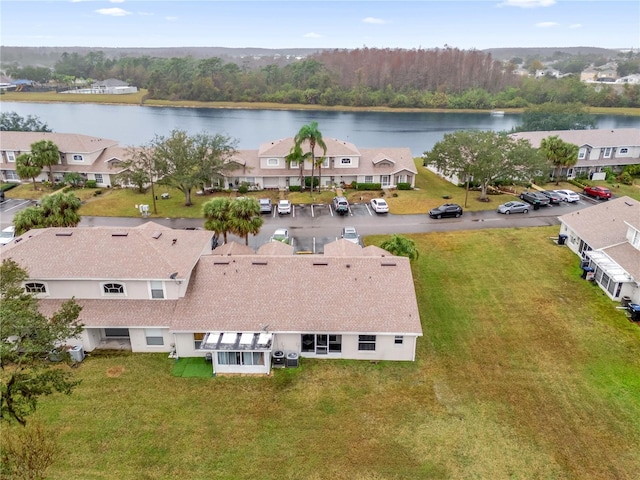 drone / aerial view with a water view