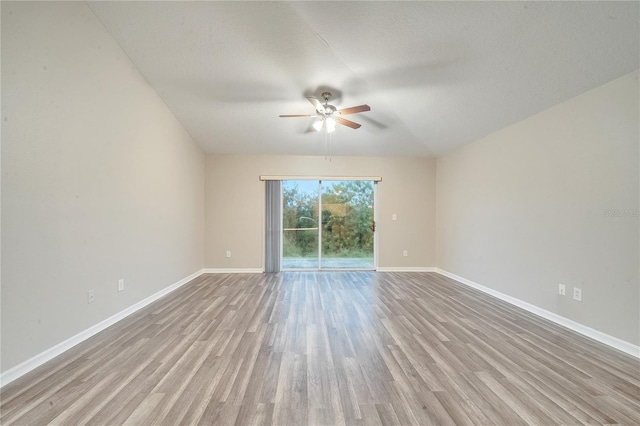 unfurnished room featuring light hardwood / wood-style floors, ceiling fan, and a textured ceiling