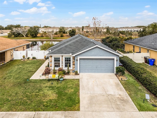 single story home with a garage and a front lawn