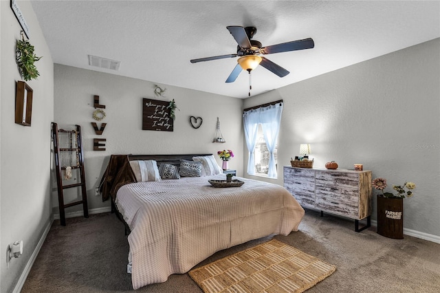 carpeted bedroom featuring a textured ceiling and ceiling fan