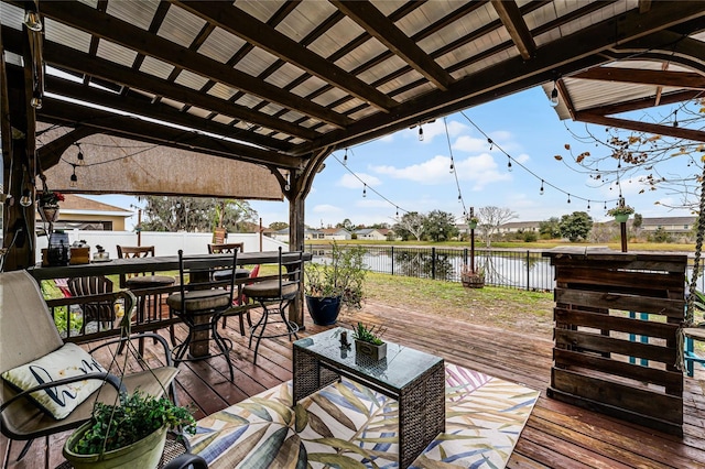 wooden deck featuring a water view