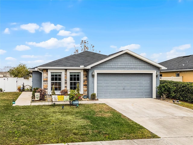 view of front facade with a front yard and a garage