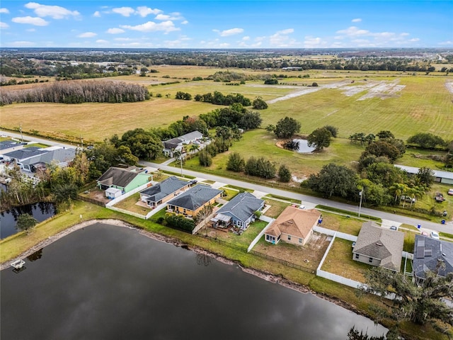 bird's eye view with a water view and a rural view