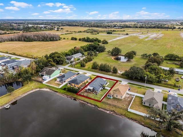 birds eye view of property featuring a rural view and a water view