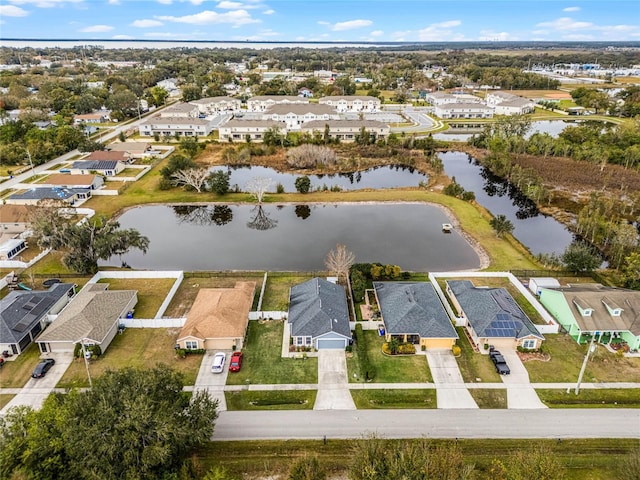 birds eye view of property with a water view