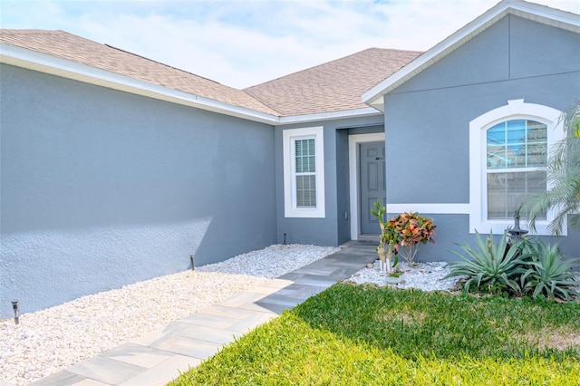 property entrance featuring a yard