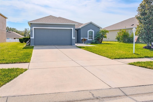 single story home featuring a garage and a front yard