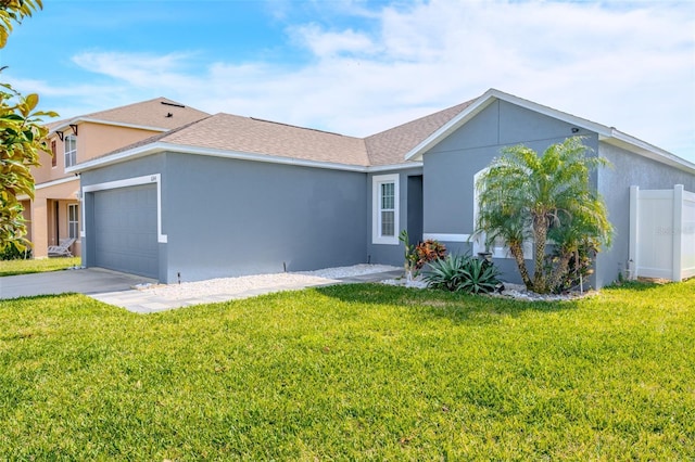 exterior space with a garage and a lawn