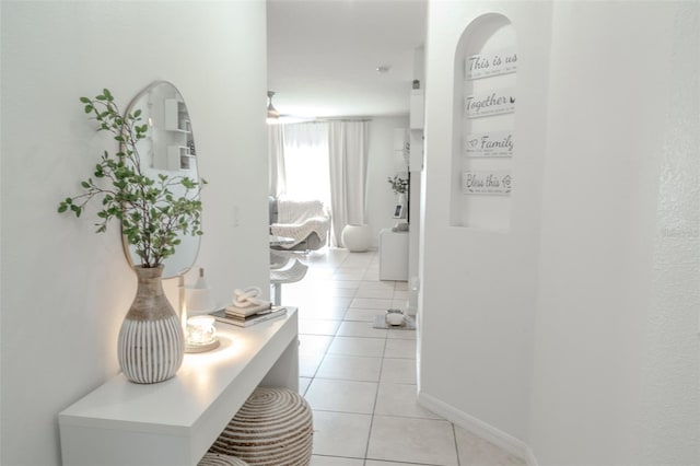 corridor featuring light tile patterned flooring