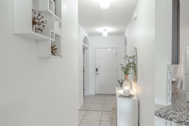 hallway with light tile patterned floors