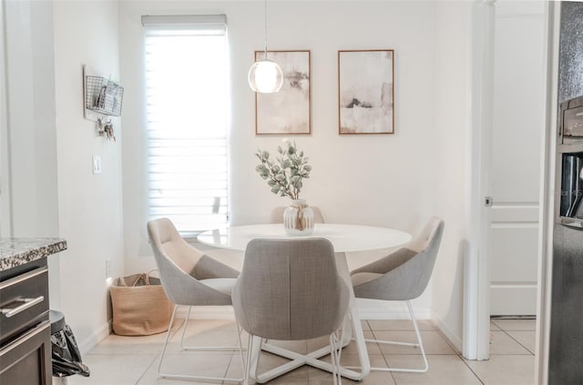 dining area with light tile patterned flooring