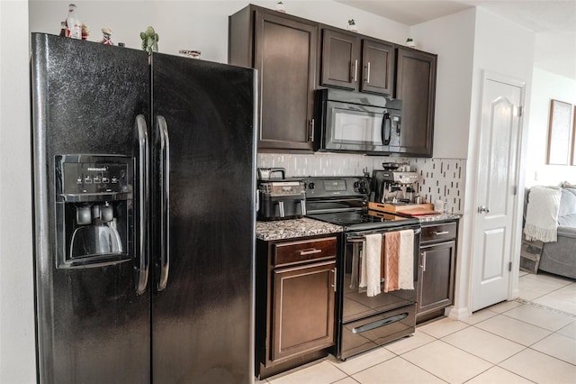 kitchen featuring tasteful backsplash, light tile patterned floors, dark brown cabinets, and black appliances