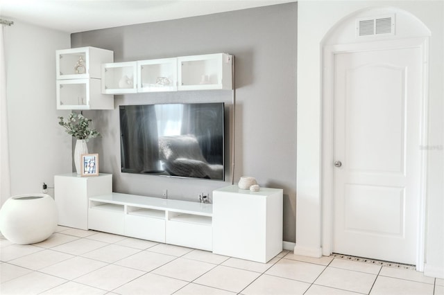 unfurnished living room featuring light tile patterned flooring