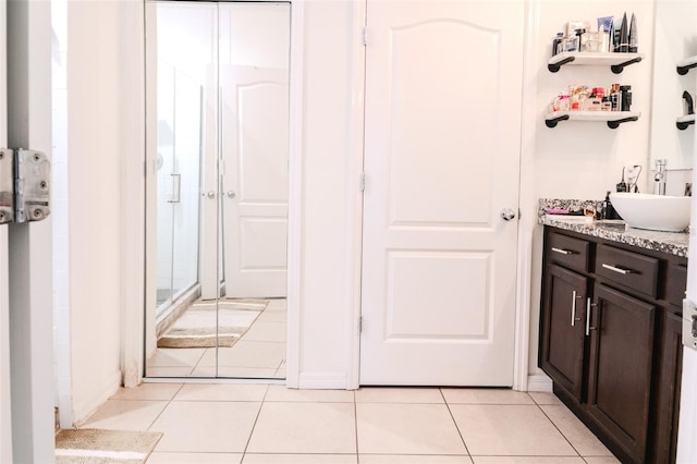 bathroom with vanity, tile patterned floors, and walk in shower