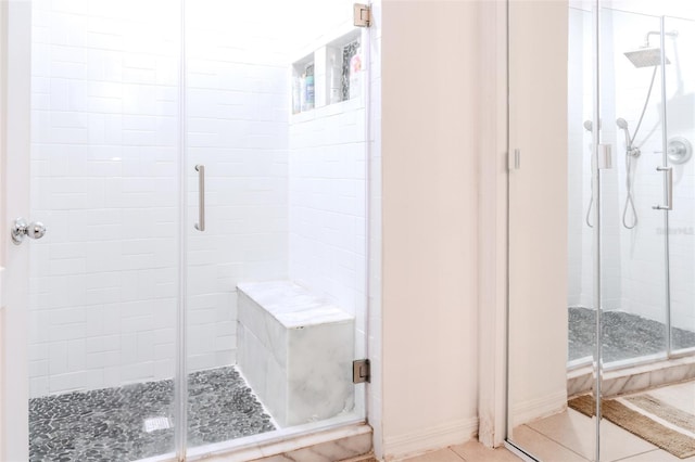 bathroom featuring walk in shower and tile patterned floors