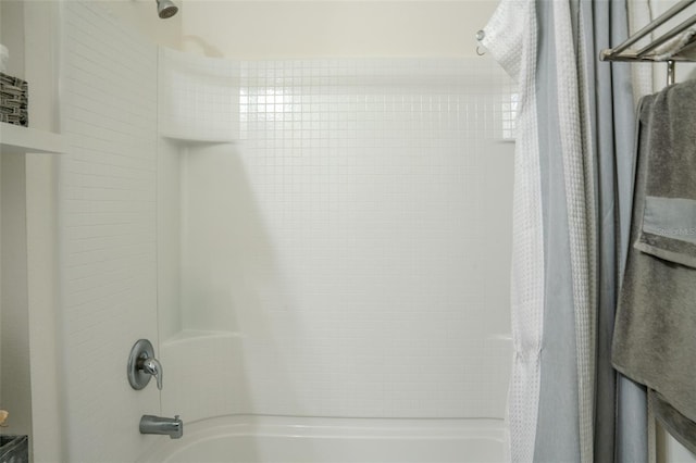 bathroom with shower / tub combo with curtain