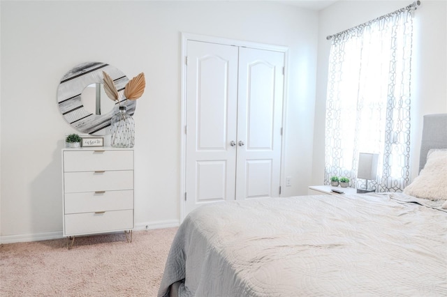 bedroom featuring a closet and carpet