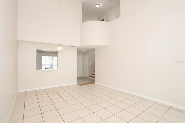 spare room featuring a high ceiling