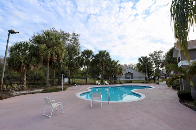 view of swimming pool with a patio area