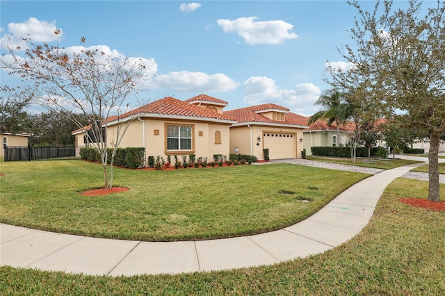 mediterranean / spanish house featuring a garage and a front lawn