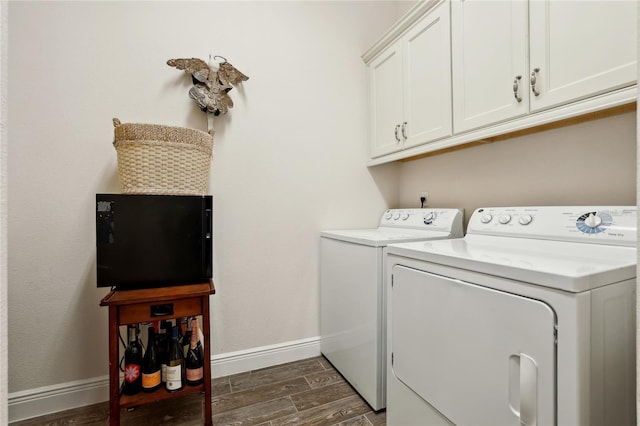 washroom featuring cabinets and washer and dryer