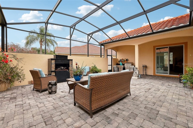 view of patio / terrace featuring a lanai and an outdoor living space