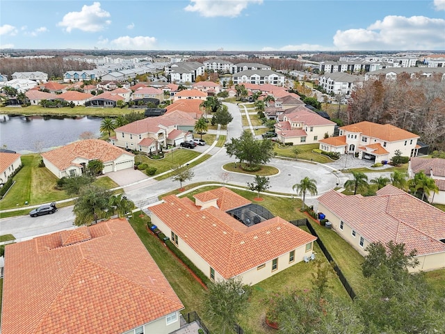 bird's eye view with a water view