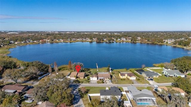 birds eye view of property with a water view