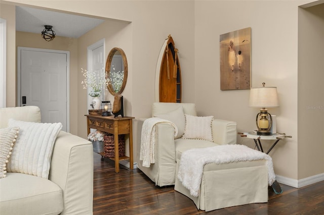 sitting room featuring a textured ceiling and dark hardwood / wood-style flooring